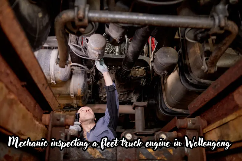 mechanic inspecting a fleet truck engine in wollongong